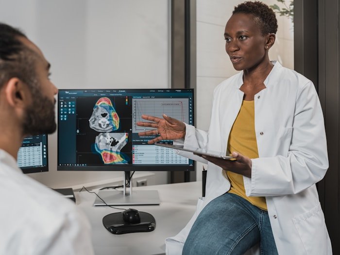 Clinician reviewing data on a screen with a patient — eating disorder and disordered-eating support