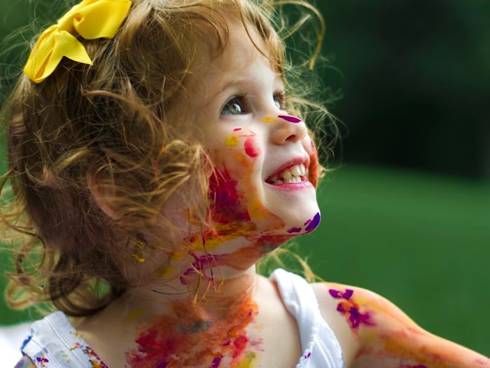 A young child smiling warmly — pediatric and family nutrition care